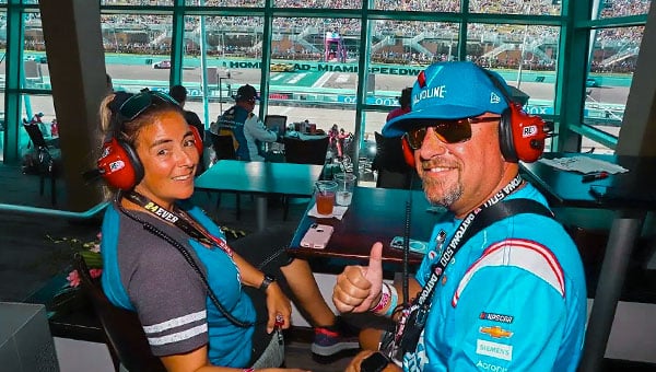 Fans smiling for photo with RE Scanner headsets inside Pitbox Hospitality